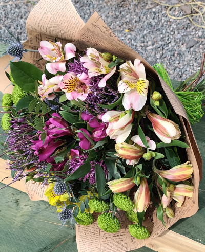 Summer Breeze - A simple bunch of bright and beautiful seasonal flowers, wrapped in kraft paper and tied with raffia.