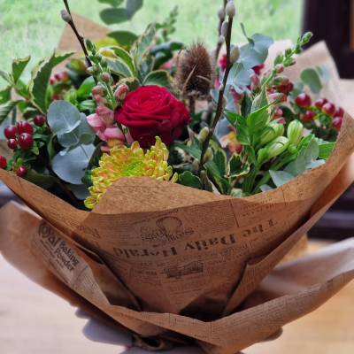 Christmas Carol - A stunning  traditional, handtied bunch of festive blooms and foliage, the perfect gift to just pop into a vase....add a vase or a box of chocolates for that extra special gift.