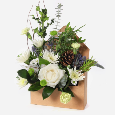 Letter to Santa - A petite design, ideal as a gift where space is limited,  Flowers arranged in a water pocket so easy to care for.  Also available in red