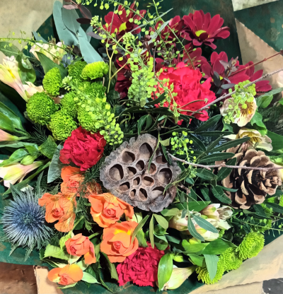 Winter Breeze - A seasonal bunch of flowers, wrapped in kraft paper and tied with raffia, an ideal gift tied ready to place in a vase.  Add chocolates for that little extra.